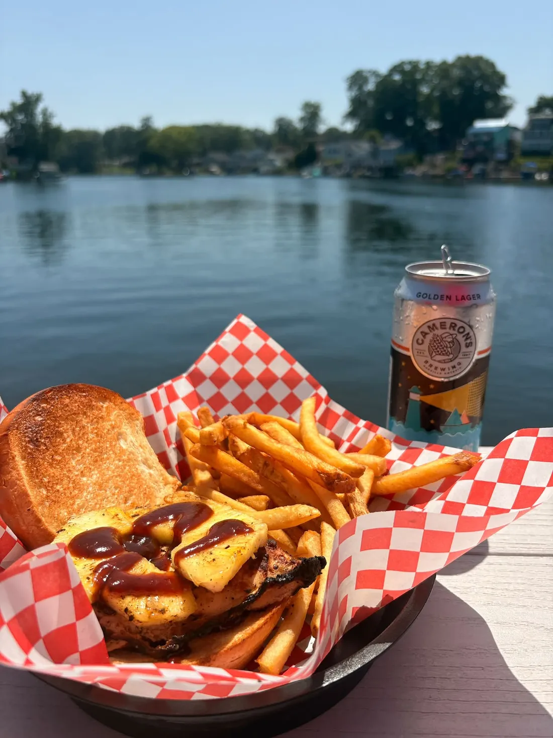 The Hawaiian Chicken: grilled chicken with a fresh pineapple ring and sweet barbeque sauce, with fries at the water’s edge