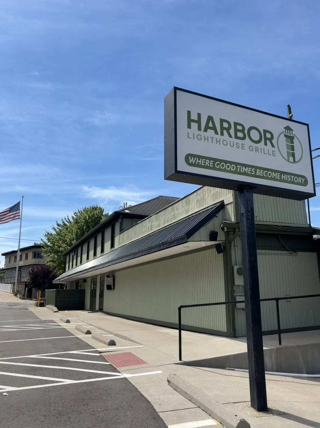 The Harbor Lighthouse Grille road sign on Portage Lakes Drive: Where Good Times Become History